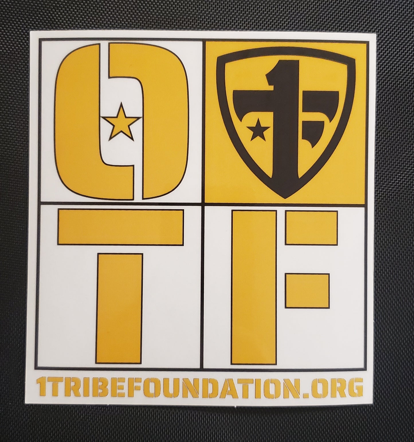 One Tribe Foundation transparent sticker in black and gold.