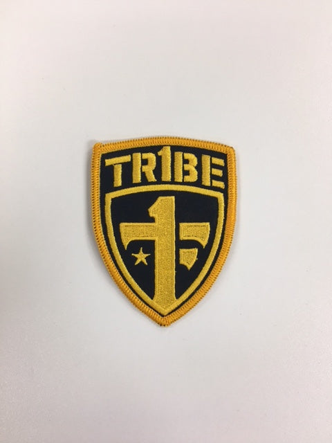"TR1BE" One Tribe Foundation gold patch.